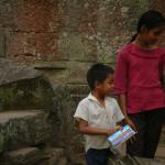 Kids selling postcards.