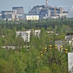 Pripyat's amusement park with reactor 4 in the background.