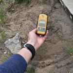 Geiger counter showing off the charts radiation. A reading of up to .30 is considered safe and naturally found in nature. This area is over 25!
