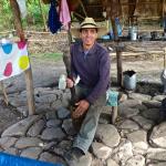 Grinding coffee beans the hard way.