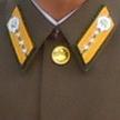Lapel pin everyone in Pyongyang wears of the "great leaders".  Most pins portray only one of the leaders but if someone has done something extraordinary, they have both pics on their pin.