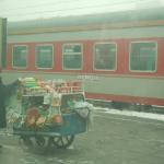Lady selling her goods on the train platform.