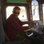 Chat chewing bus driver (note the tape holding the steering column together).