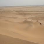 As we started climbing the dunes to go sandboarding.