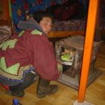 Lighting our stove inside the ger.