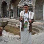 Holding the jambiya (tribesman's ceremonial dagger) worn by men in Yemen and southern Saudi Arabia.